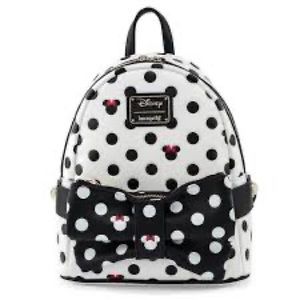 Black and white polka dot Disney Loungefly bag.